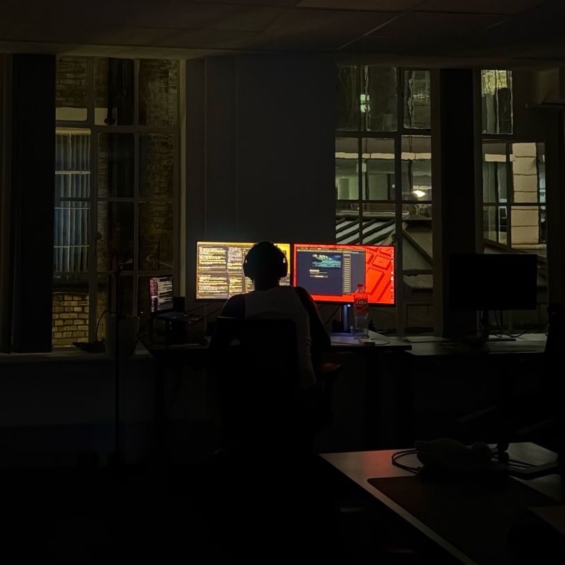 Tobi coding alone in a dark office at 2am