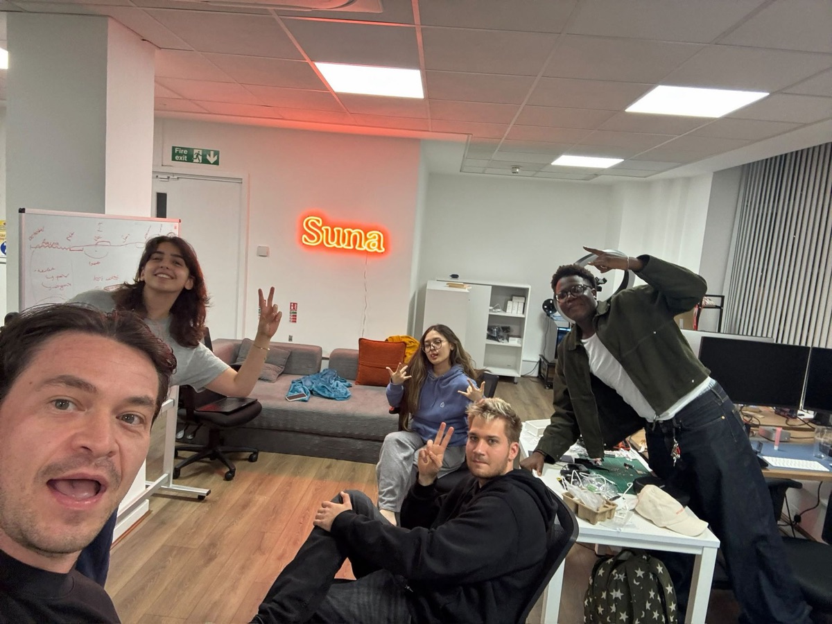 Tobi with the SUNA team in the office